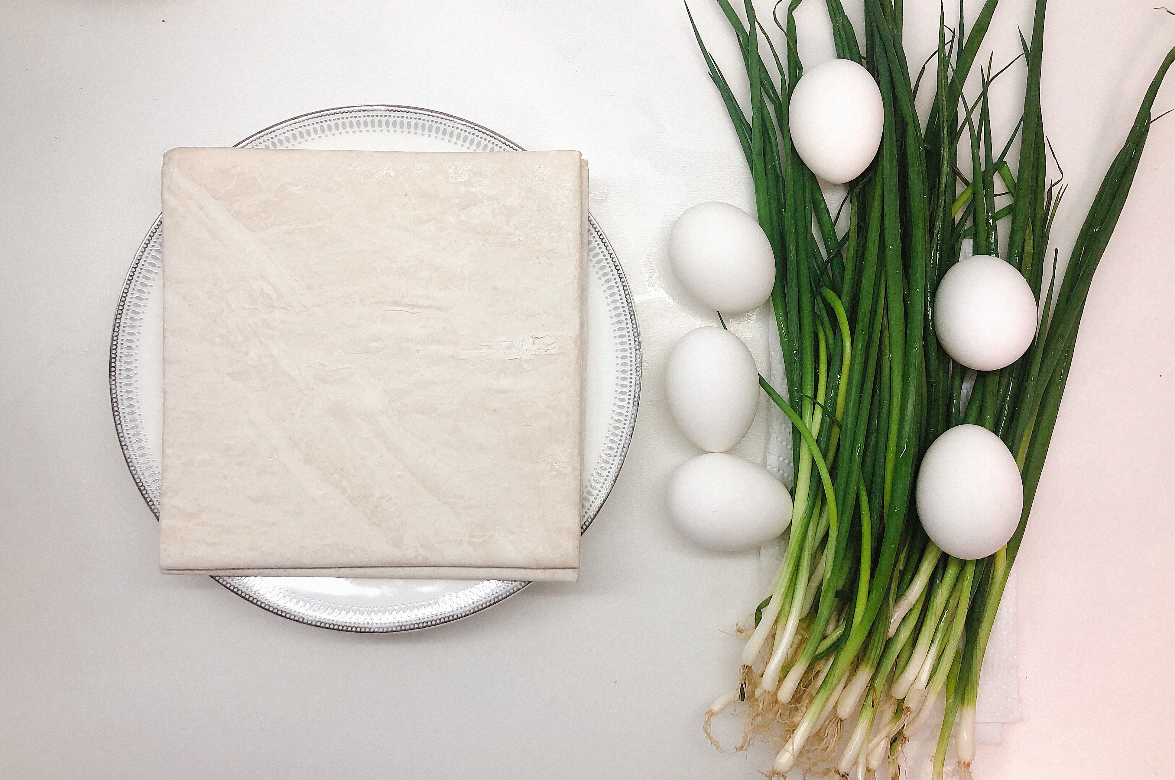 Ingredients for pie with spring onion and eggs