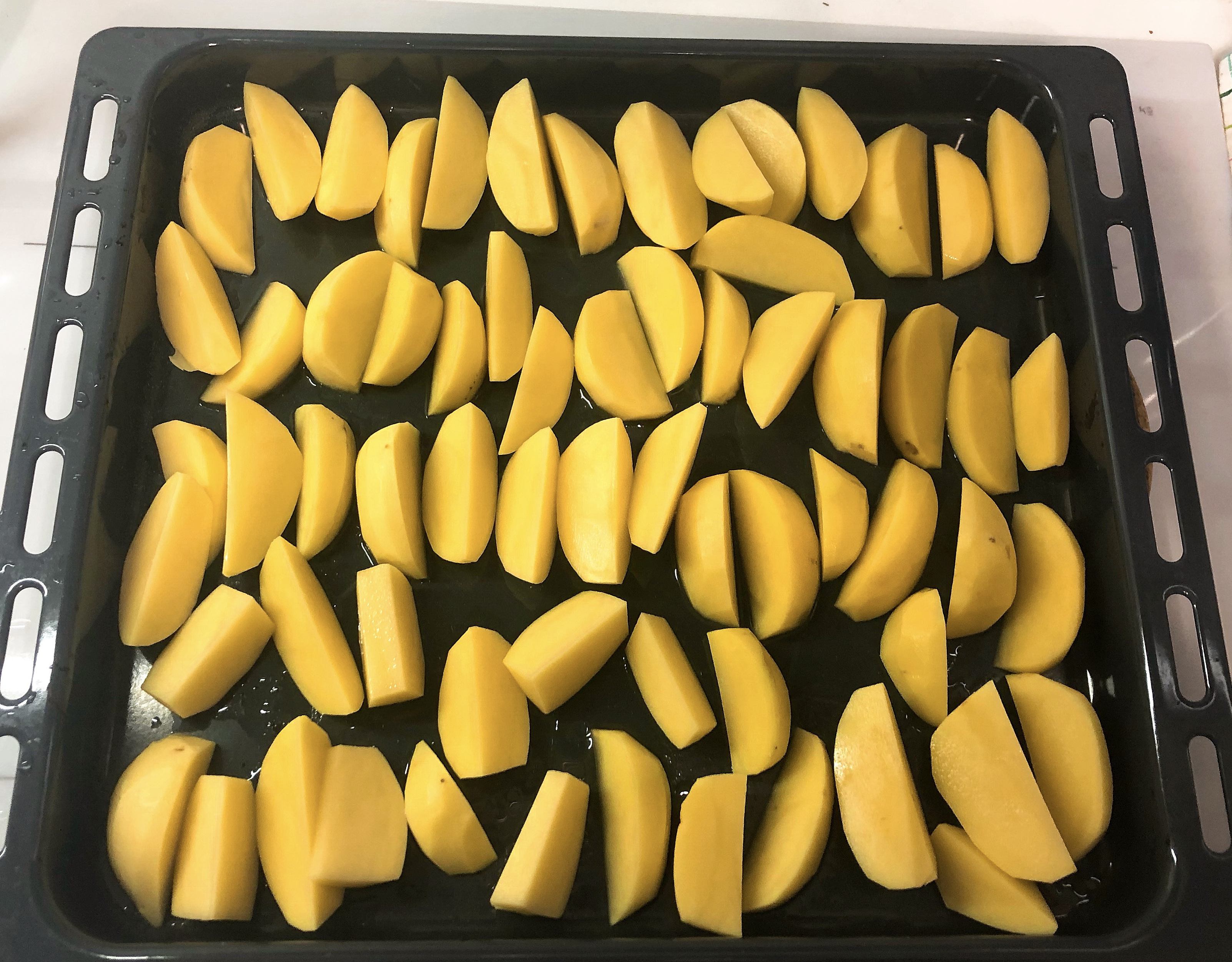 Potato slices on the baking dish