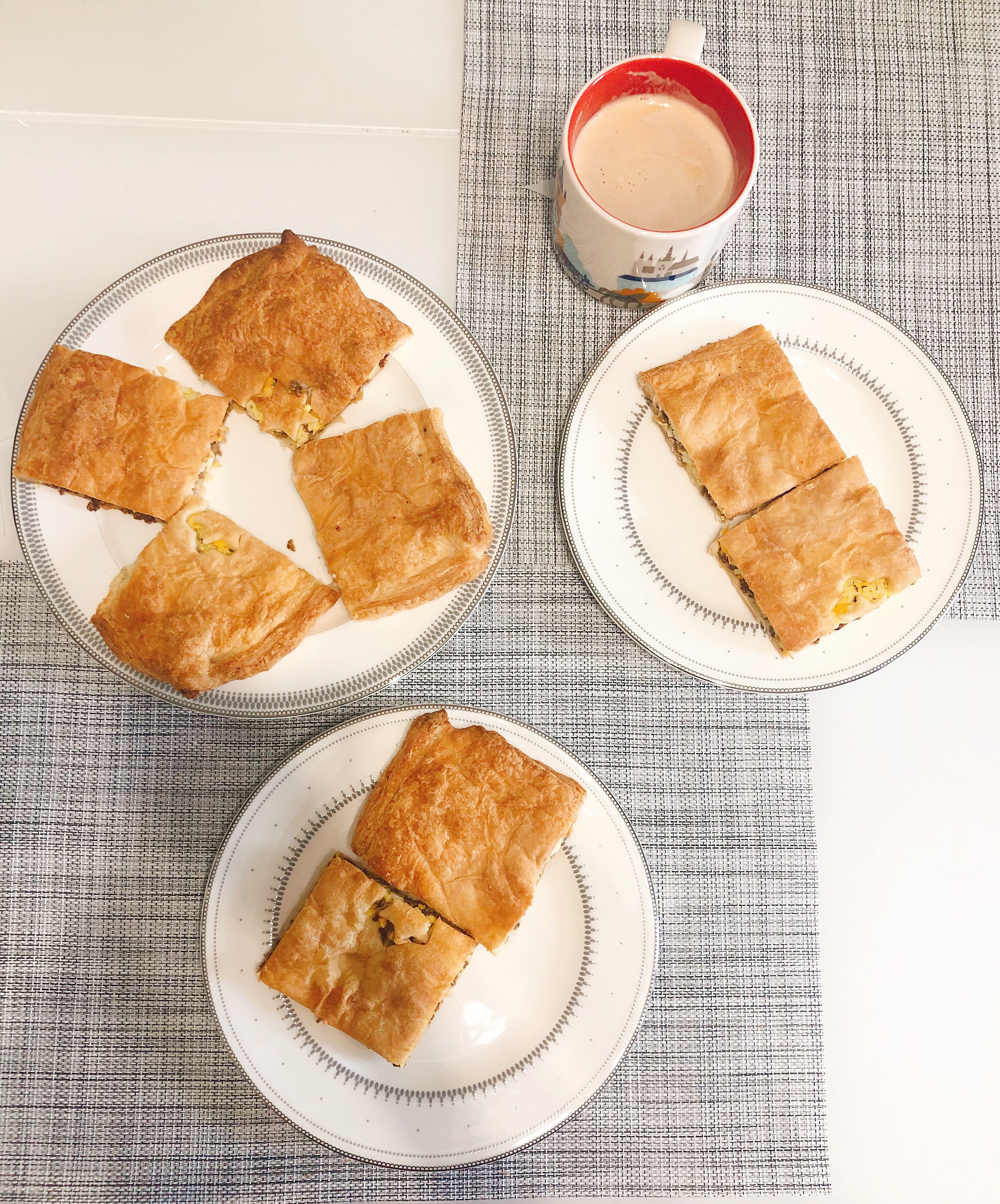 Served pie with minced meat and eggs in the oven